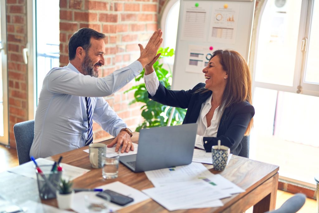 TimeClick - Time Tracking - Managers High Fiving Each Other